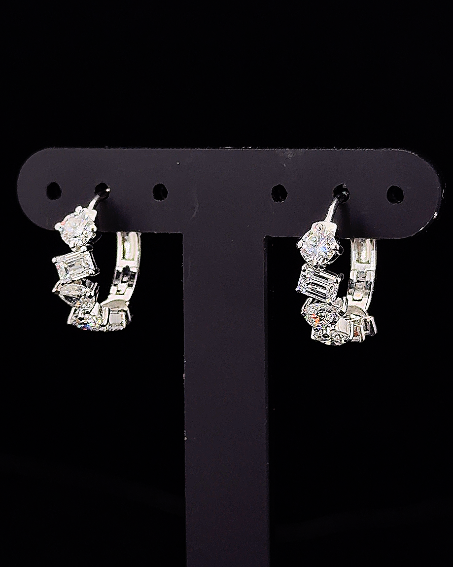 White gold hoop earrings with round, pear and emerald lab grown diamonds on black