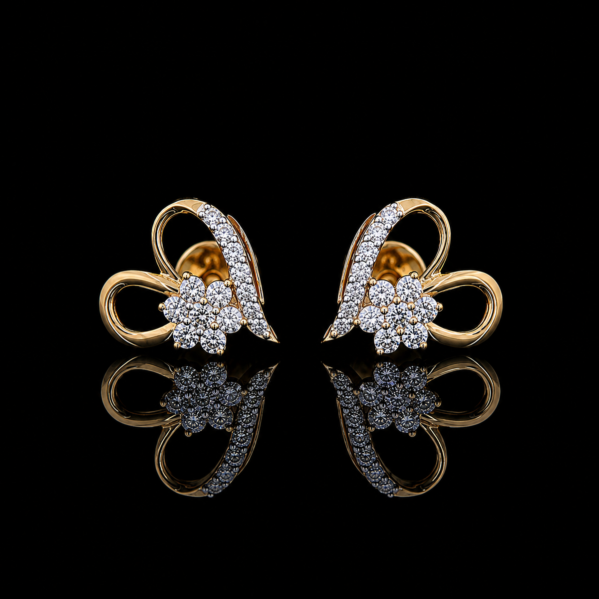 Yellow gold floral heart earrings with round lab grown diamonds photographed on black