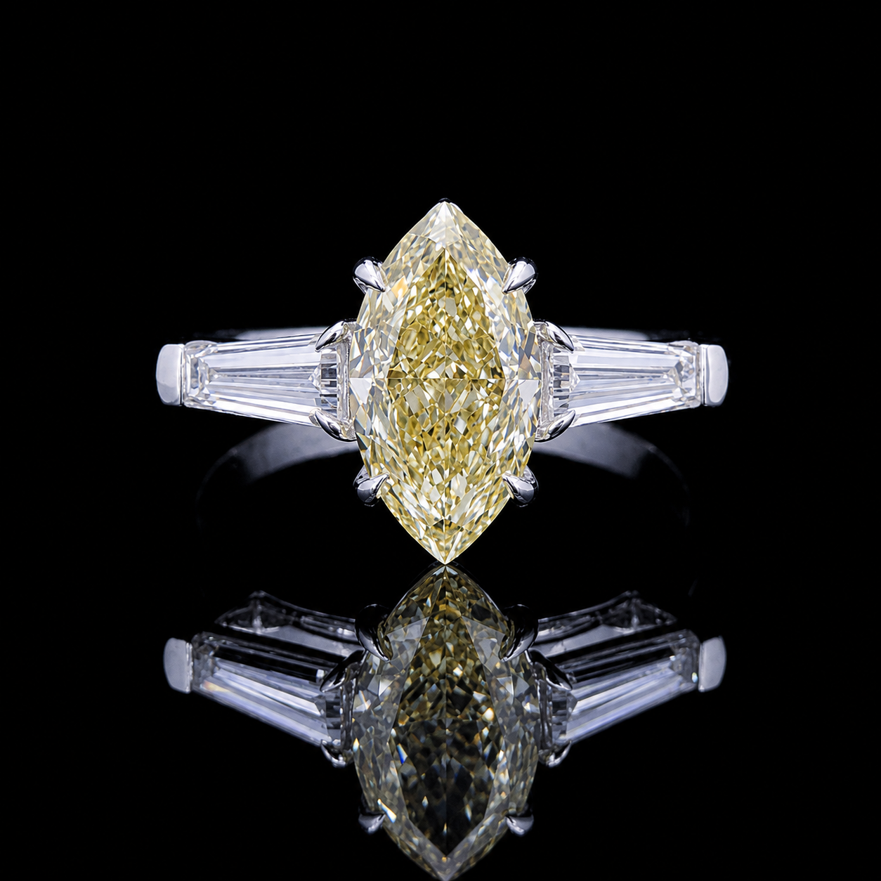 Main: White gold 1.77ct yellow marquise ring with tapered baguette lab grown diamond sides on black
Detail: Close-up of yellow marquise lab grown diamond flanked by two tapered baguettes in white gold
Side: White gold three-stone ring with yellow marquise centre and tapered baguette lab grown diamonds