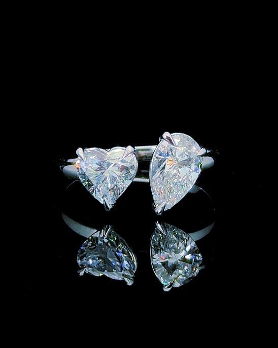 Main: White gold 2.08ct pear and heart toi et moi ring with lab grown diamonds on black
Detail: Close-up of pear and heart-cut lab grown diamonds facing in a white gold two-stone setting
Side: White gold toi et moi ring showing raised pear and heart lab grown diamond settings