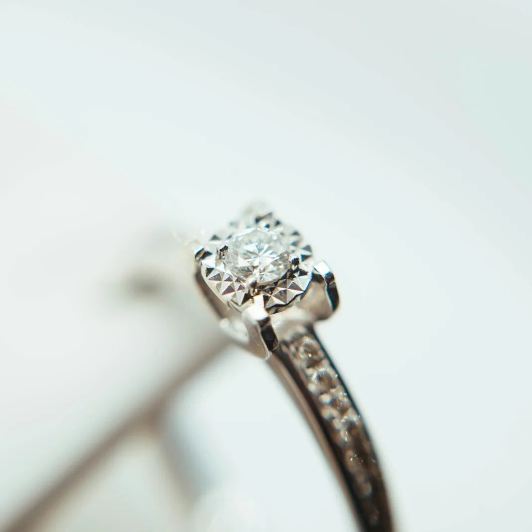 Silver ring set with a clear faceted gemstone
