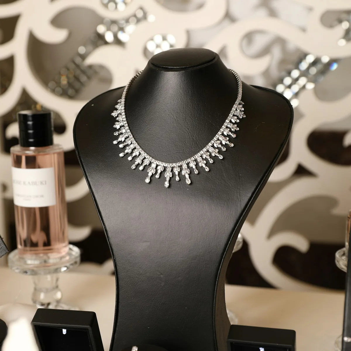 Diamond necklace displayed on a jewelry stand