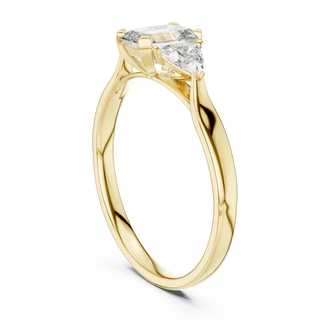 emerald lab grown diamond three stone engagement ring in yellow gold