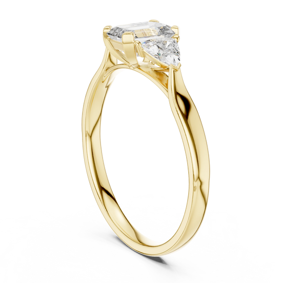 emerald lab grown diamond three stone engagement ring in yellow gold