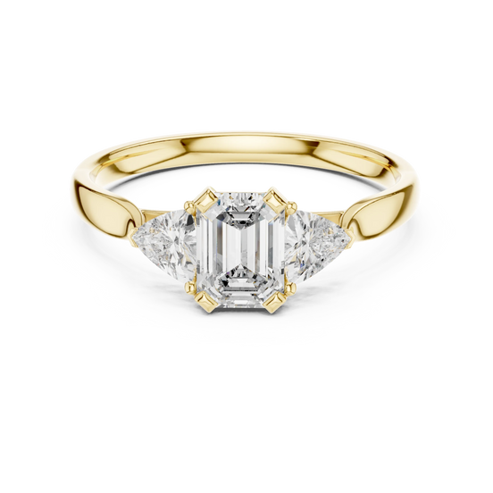 emerald lab grown diamond three stone engagement ring in yellow gold