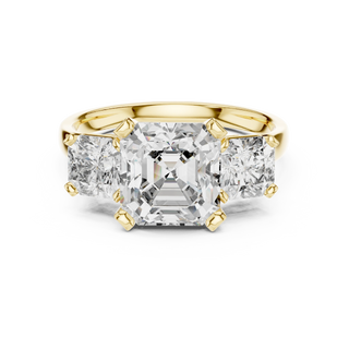 Emerald lab grown diamond three stone ring in yellow gold