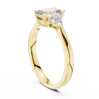 emerald lab grown diamond three stone ring in yellow gold