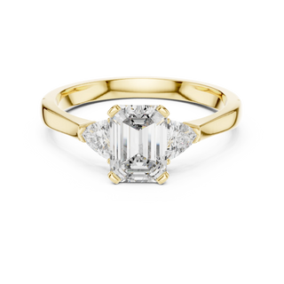 emerald lab grown diamond three stone ring in yellow gold