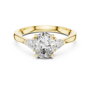 oval lab grown diamond three stone ring in yellow gold