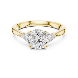 round lab grown diamond three stone ring in yellow gold