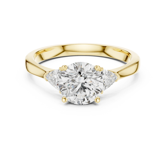 round lab grown diamond three stone ring in yellow gold