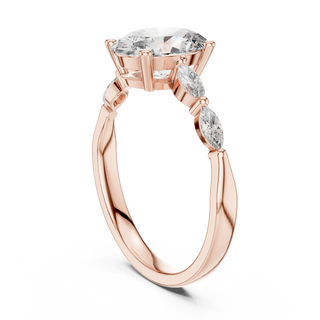 oval diamond marquise side-stone ring in rose gold
