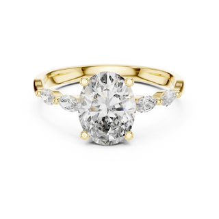 oval diamond marquise side-stone ring in yellow gold
