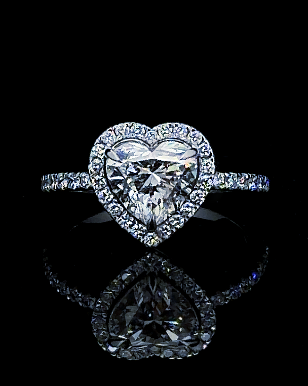 Main: White gold 2.00ct heart halo ring with pave lab grown diamond accents on black
Detail: Close-up of 2.00ct heart-cut lab grown diamond framed by a white gold diamond halo
Side: White gold heart halo ring with raised profile and lab grown diamond pave shoulders