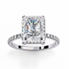 White gold radiant cut lab grown diamond engagement ring with a diamond halo and pavé band.