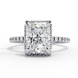 White gold radiant cut lab grown diamond engagement ring with a diamond halo and pavé band.