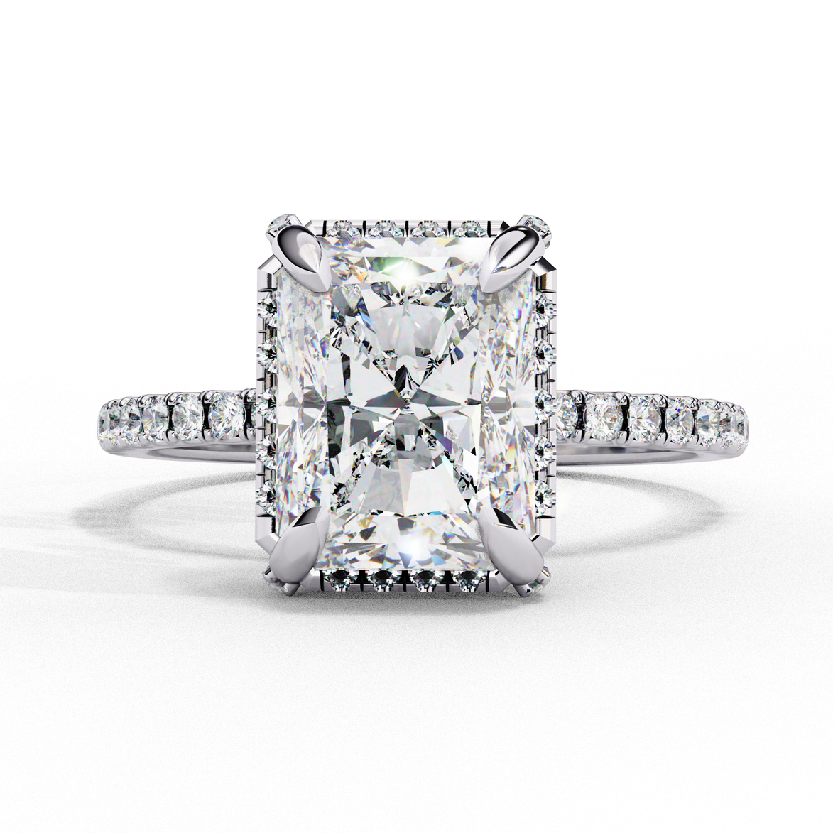 White gold radiant cut lab grown diamond engagement ring with a diamond halo and pavé band.