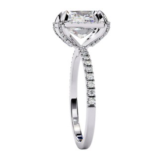 Radiant cut diamond engagement ring in white gold from a side angle.