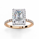 Rose gold radiant cut lab grown diamond engagement ring with a diamond halo and pavé band.