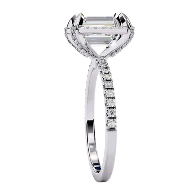 Emerald cut diamond engagement ring in white gold from a side angle.
