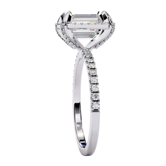 Emerald cut diamond engagement ring in white gold from a side angle.