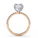 Side profile of a radiant cut lab grown diamond engagement ring with a hidden halo and pavé band in white gold.