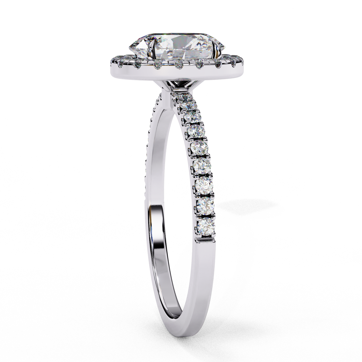 Side profile view of a white gold oval cut diamond engagement ring with a pavé band.
