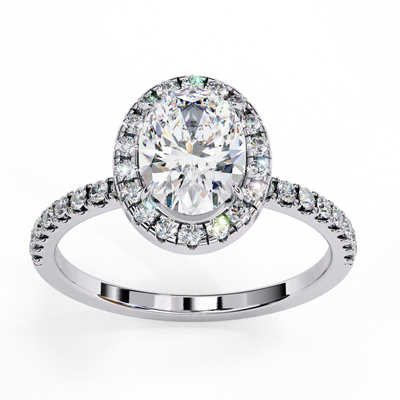 Top-down view of a white gold oval cut diamond engagement ring with a brilliant diamond halo.