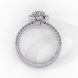 Side profile of a white gold oval cut diamond engagement ring showing the low-profile basket construction.