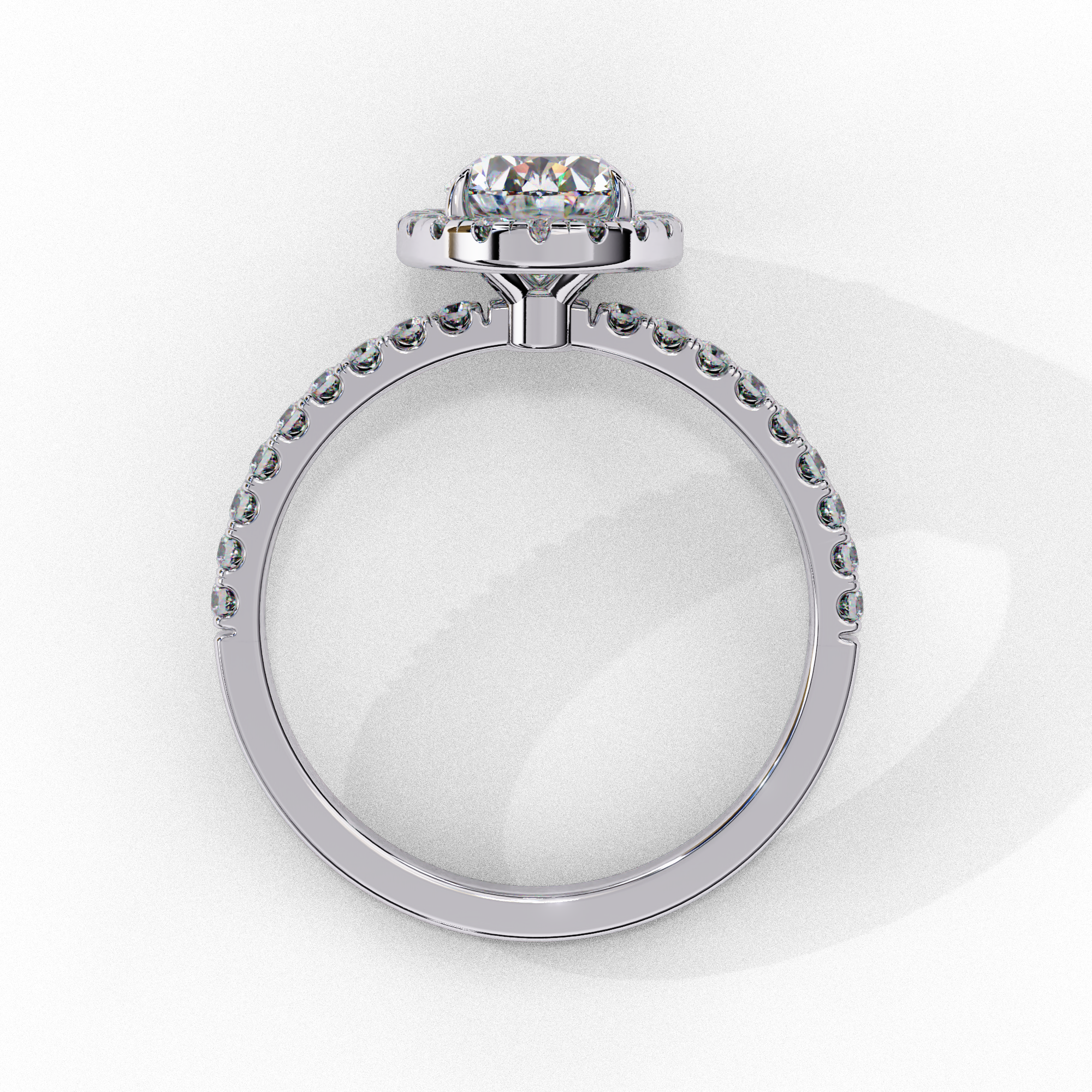 Side profile of a white gold oval cut diamond engagement ring showing the low-profile basket construction.