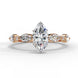 Front view of a rose gold marquise cut diamond engagement ring with alternating marquise and round brilliant side stones.