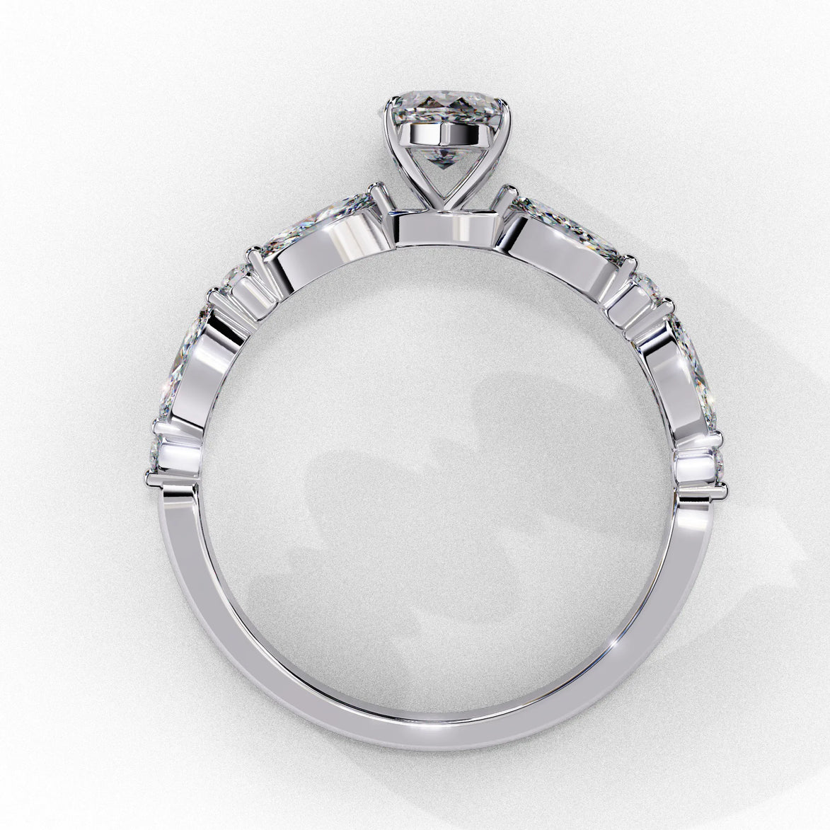 Side profile view of a white gold marquise cut diamond engagement ring highlighting the open under-gallery construction.