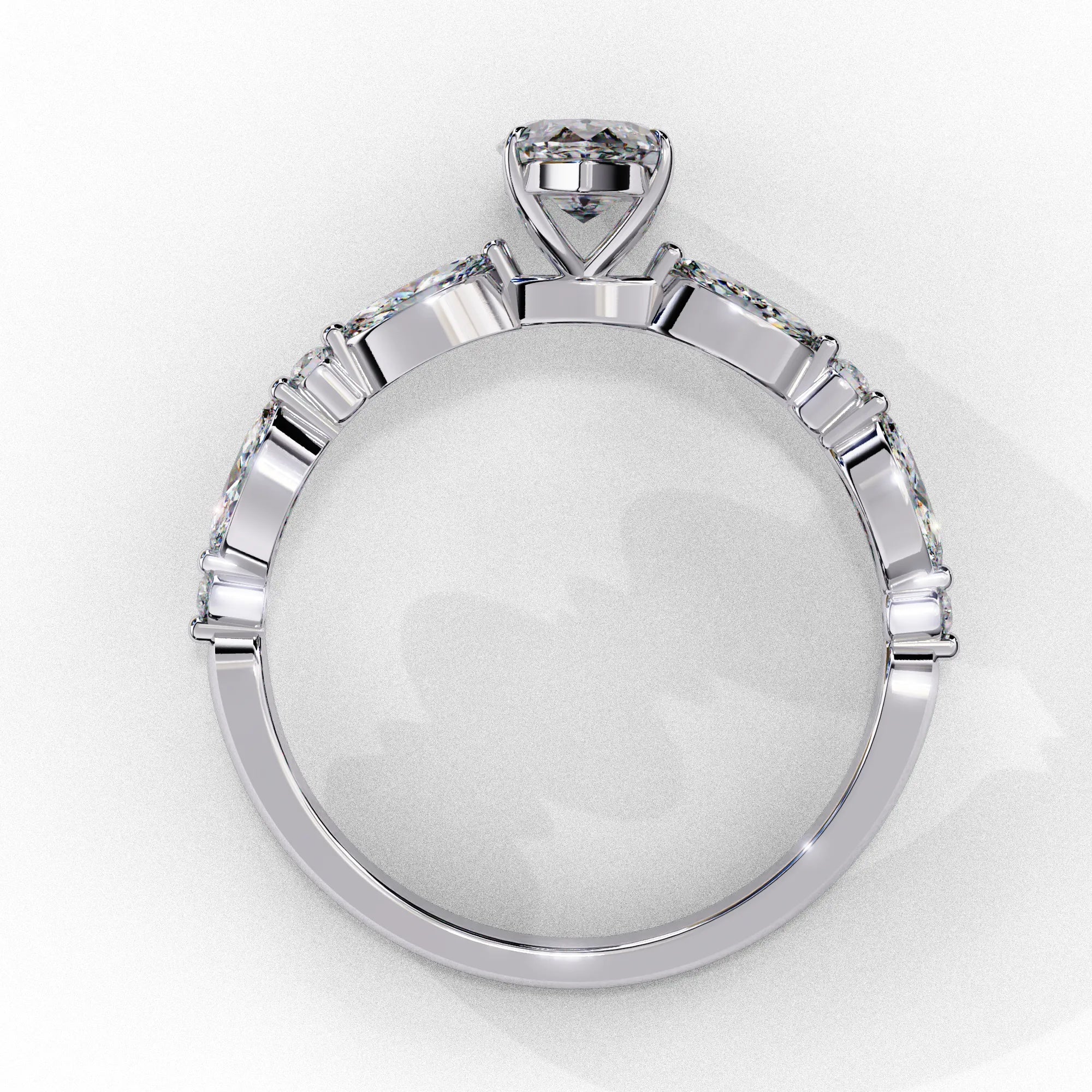 Side profile view of a white gold marquise cut diamond engagement ring highlighting the open under-gallery construction.