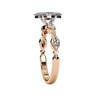 Side profile view of a rose gold marquise cut diamond engagement ring showcasing an elegant cathedral gallery profile.