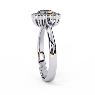 : Side profile view of a white gold art deco emerald halo diamond ring.