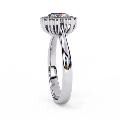 : Side profile view of a white gold art deco emerald halo diamond ring.