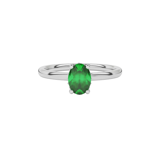Close-up oval cut emerald green gemstone ring, white gold pavé basket.