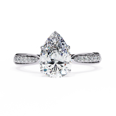 Diamond ring with a pear-shaped center stone on a white background