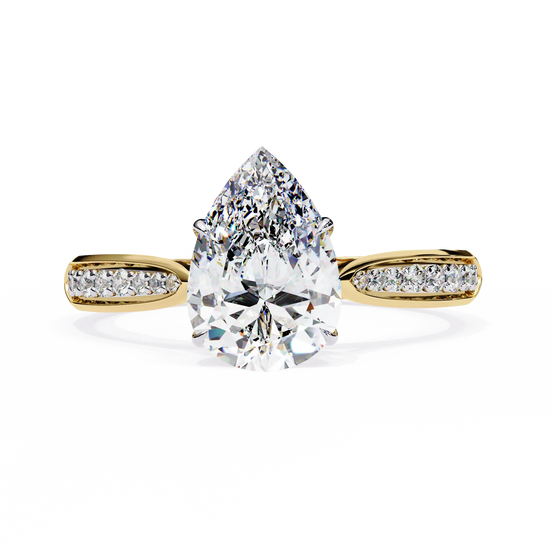 Gold ring with a pear-shaped diamond on a white background