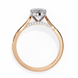 Rose gold ring with a diamond on a white background