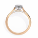 Rose gold ring with a diamond on a white background
