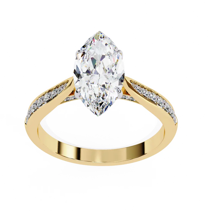 Gold ring with a pear-shaped diamond on a white background