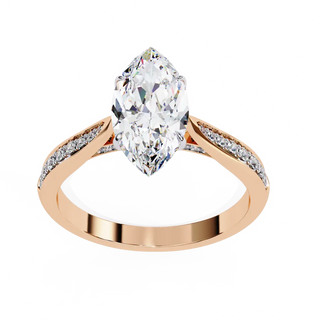 Rose gold ring with a pear-shaped diamond on a white background