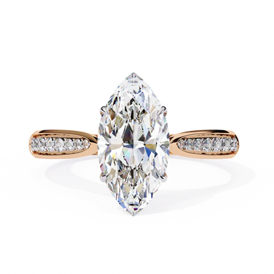 Diamond ring with a marquise-shaped center stone on a white background