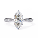 Diamond ring with a pear-shaped center stone on a white background