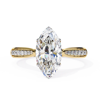Gold ring with a large marquise-shaped diamond and smaller diamonds on the sides against a white background