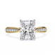Gold ring with a large diamond and smaller diamonds on the band against a white background