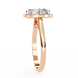 Rose gold ring with three diamonds on a white background
