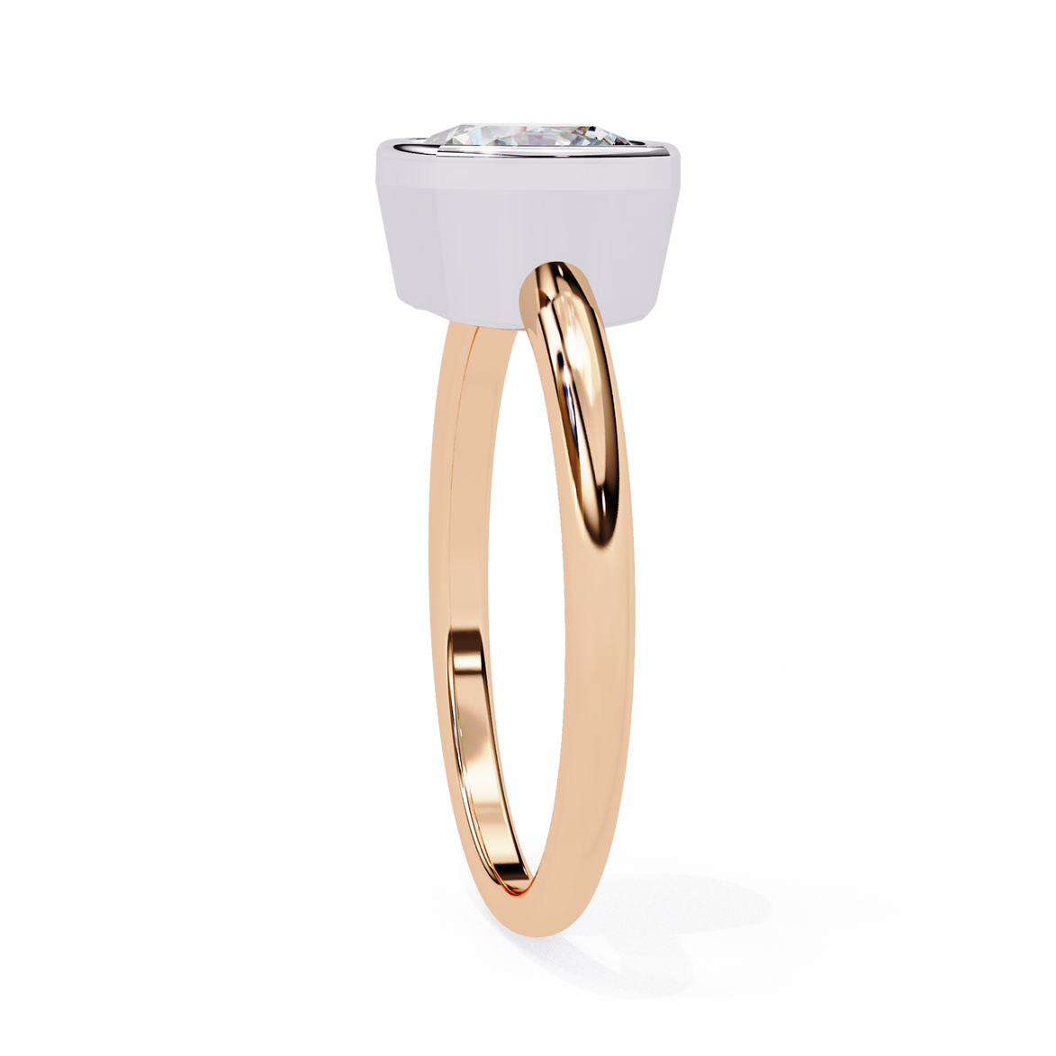 Cushion cut bezel set diamond solitaire engagement ring in yellow gold featuring a sleek modern minimalist design with polished finish.
