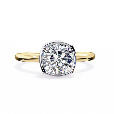 Gold ring with a large diamond on a white background